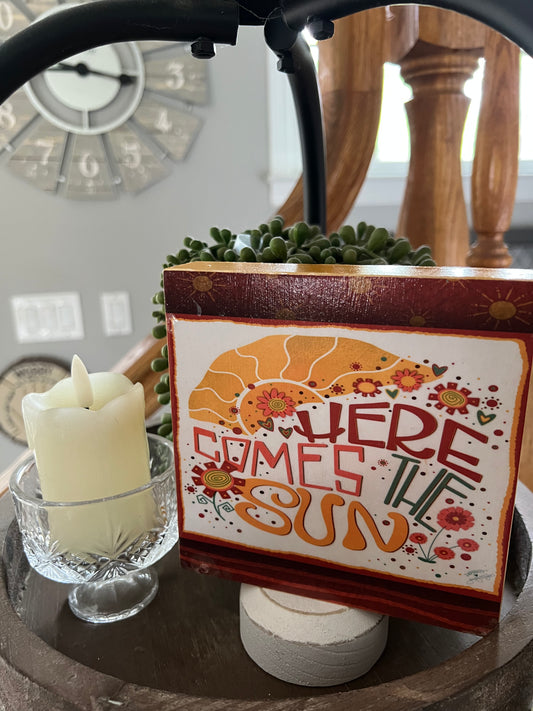 HERE COMES THE SUN